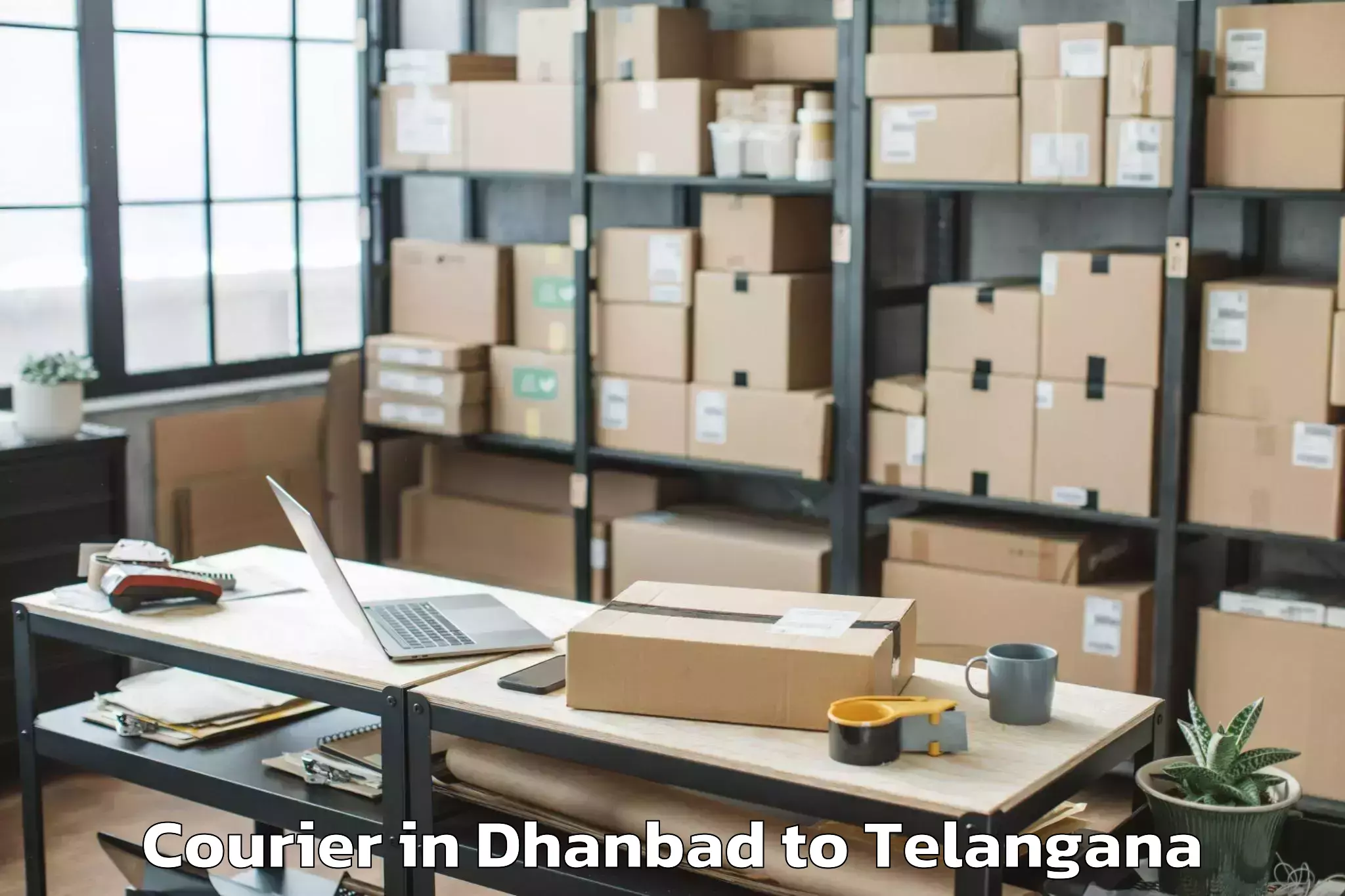 Reliable Dhanbad to Mancheral Courier